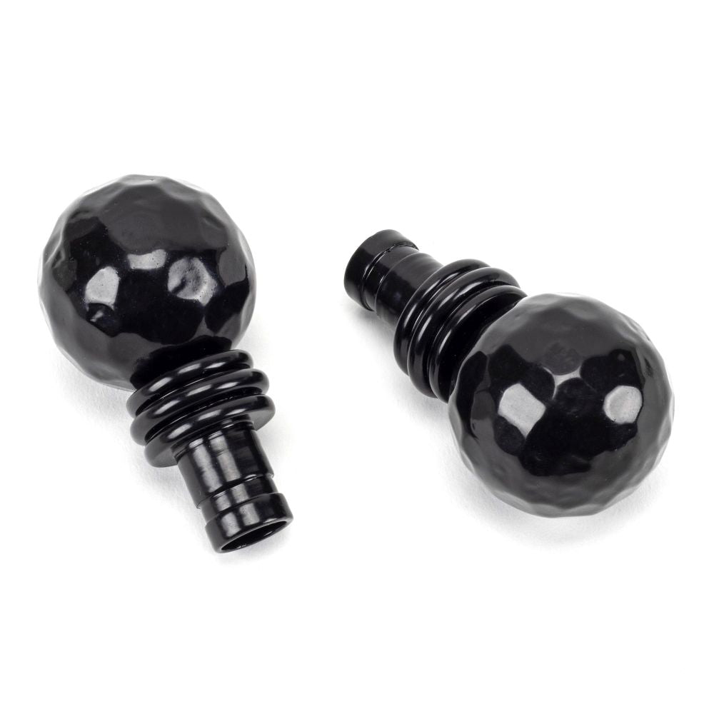 This is an image showing From The Anvil - Black Hammered Ball Curtain Finial (pair) available from trade door handles, quick delivery and discounted prices