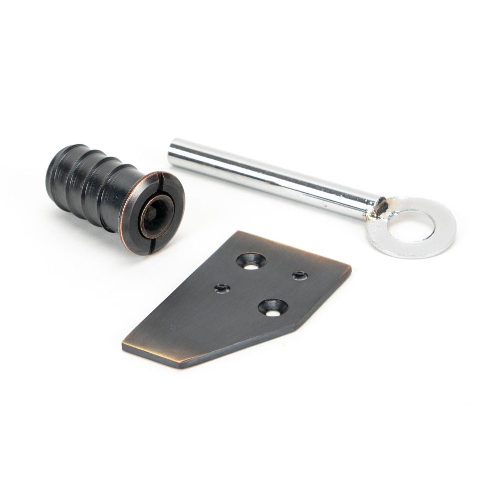 This is an image showing From The Anvil - Aged Bronze Key-Flush Sash Stop available from T.H Wiggans Architectural Ironmongery in Kendal, quick delivery and discounted prices