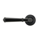 This is an image showing From The Anvil - Black Regency Lever on Rose Set (Beehive) - Unsprung available from trade door handles, quick delivery and discounted prices