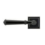 This is an image showing From The Anvil - Black Regency Lever on Rose Set (Square) - Unsprung available from trade door handles, quick delivery and discounted prices