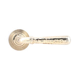 This is an image showing From The Anvil - Pol. Nickel Hammered Newbury Lever on Rose Set (Beehive) - Unsp available from trade door handles, quick delivery and discounted prices
