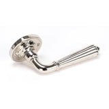 This is an image showing From The Anvil - Polished Nickel Hinton Lever on Rose Set - Unsprung available from trade door handles, quick delivery and discounted prices