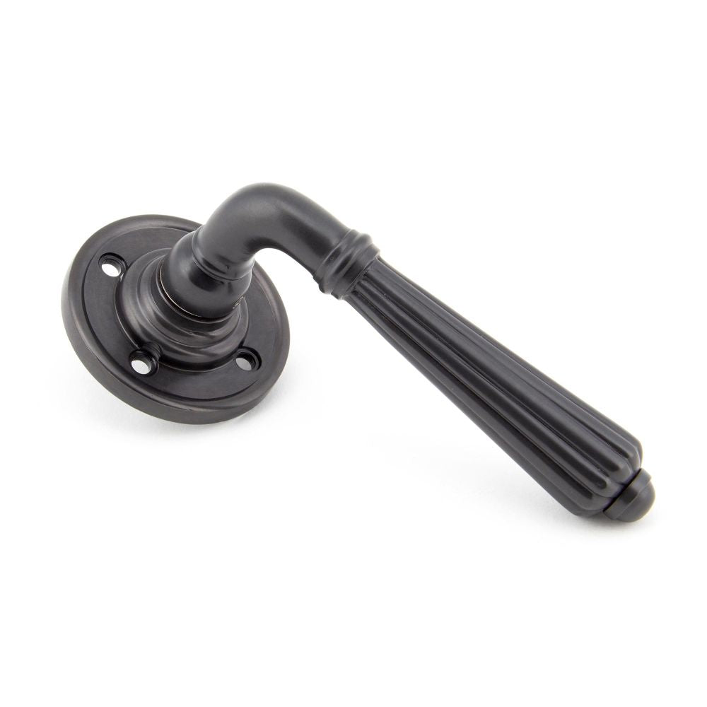 This is an image of From The Anvil - Aged Bronze Hinton Lever on Rose Set - Unsprung available to order from T.H Wiggans Architectural Ironmongery in Kendal, quick delivery and discounted prices.