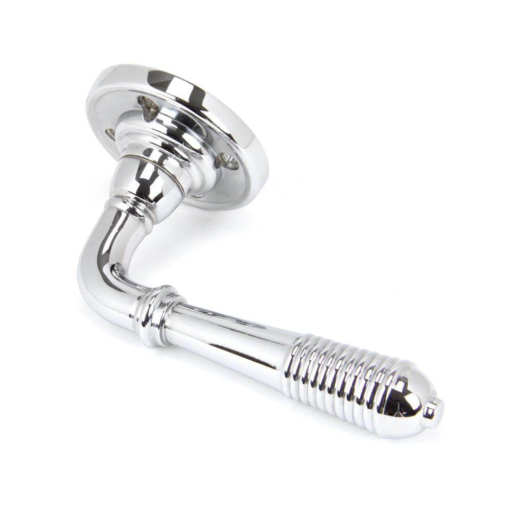 This is an image showing From The Anvil - Polished Chrome Reeded Lever on Rose Set - Unsprung available from trade door handles, quick delivery and discounted prices