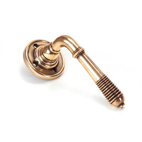 This is an image of From The Anvil - Polished Bronze Reeded Lever on Rose Set - Unsprung available to order from T.H Wiggans Architectural Ironmongery in Kendal, quick delivery and discounted prices.