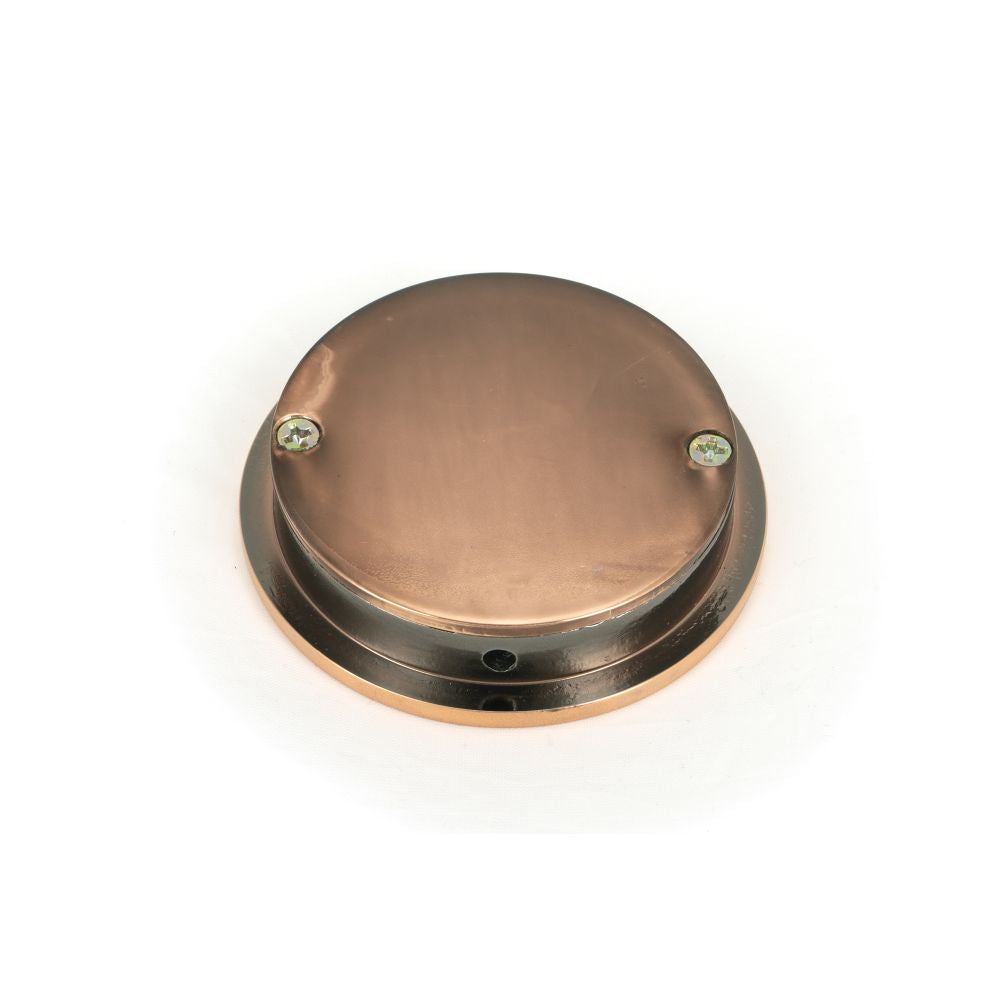 This is an image showing From The Anvil - Polished Bronze 60mm Plain Round Pull available from trade door handles, quick delivery and discounted prices