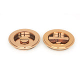 This is an image of From The Anvil - Polished Bronze 75mm Art Deco Round Pull - Privacy Set available to order from T.H Wiggans Architectural Ironmongery in Kendal, quick delivery and discounted prices.