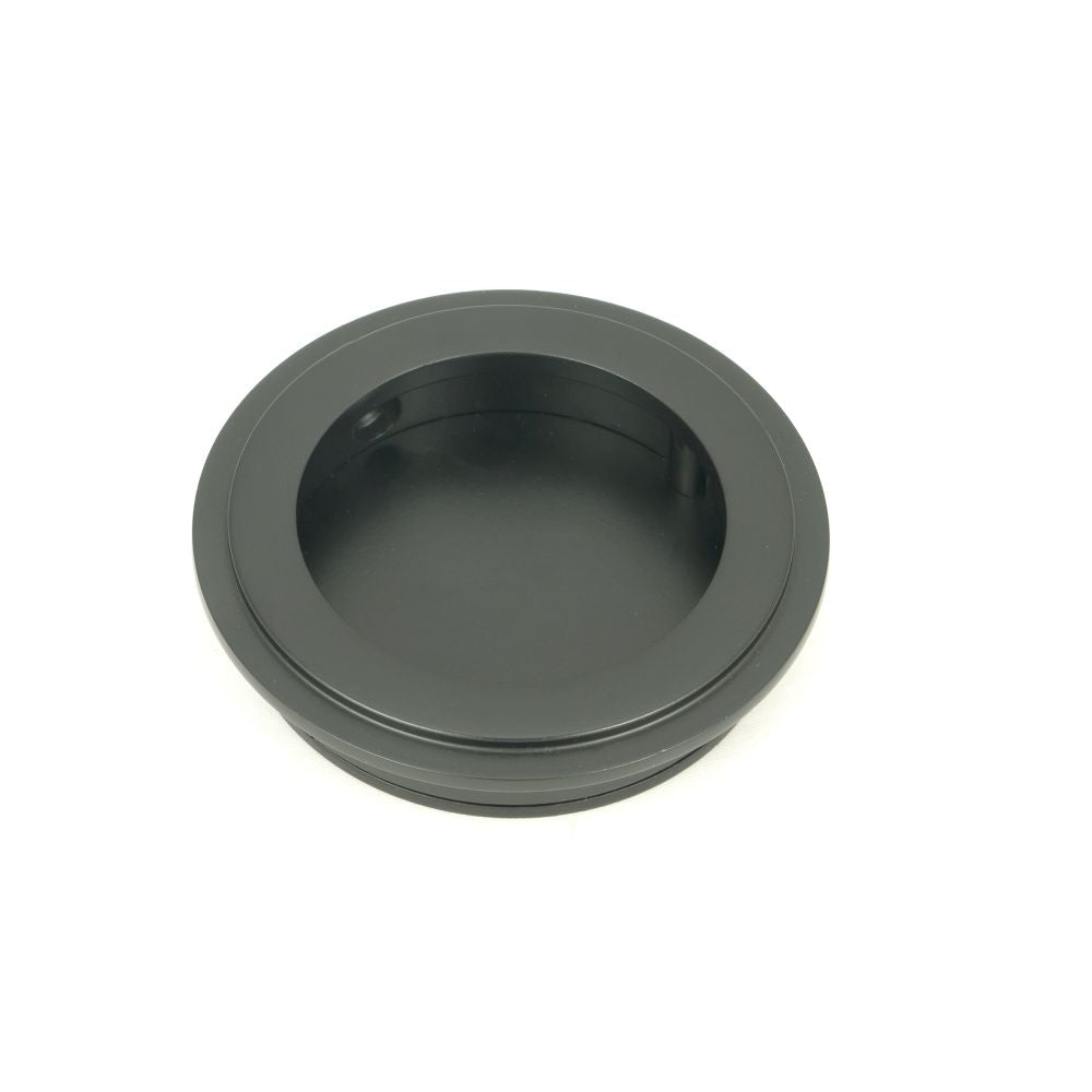 This is an image of From The Anvil - Matt Black 60mm Art Deco Round Pull available to order from T.H Wiggans Architectural Ironmongery in Kendal, quick delivery and discounted prices.