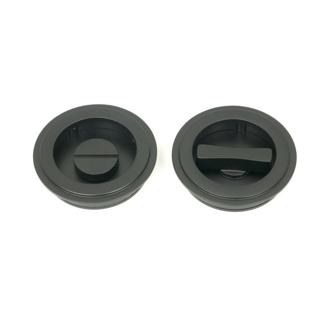 This is an image of From The Anvil - Matt Black 60mm Art Deco Round Pull - Privacy Set available to order from T.H Wiggans Architectural Ironmongery in Kendal, quick delivery and discounted prices.