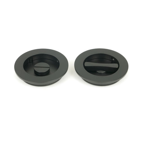 This is an image of From The Anvil - Matt Black 75mm Plain Round Pull - Privacy Set available to order from T.H Wiggans Architectural Ironmongery in Kendal, quick delivery and discounted prices.