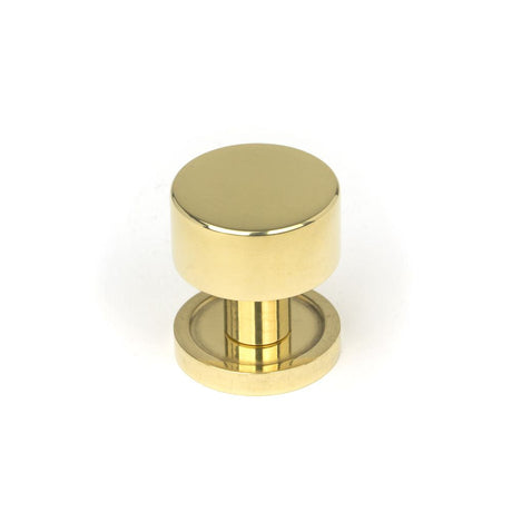 This is an image showing From The Anvil - Polished Brass Kelso Cabinet Knob - 25mm (Plain) available from T.H Wiggans Architectural Ironmongery in Kendal, quick delivery and discounted prices