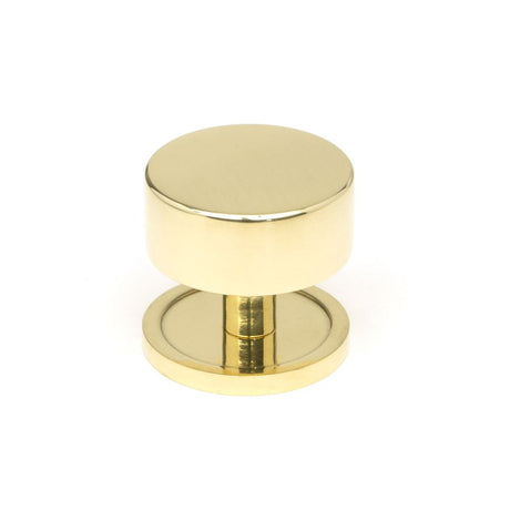 This is an image showing From The Anvil - Polished Brass Kelso Cabinet Knob - 38mm (Plain) available from T.H Wiggans Architectural Ironmongery in Kendal, quick delivery and discounted prices