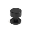 This is an image showing From The Anvil - Matt Black Kelso Cabinet Knob - 25mm (Plain) available from T.H Wiggans Architectural Ironmongery in Kendal, quick delivery and discounted prices