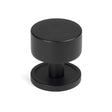 This is an image showing From The Anvil - Matt Black Kelso Cabinet Knob - 32mm (Plain) available from T.H Wiggans Architectural Ironmongery in Kendal, quick delivery and discounted prices