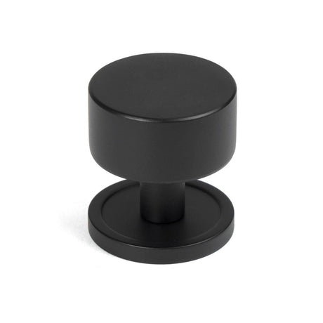 This is an image showing From The Anvil - Matt Black Kelso Cabinet Knob - 32mm (Plain) available from T.H Wiggans Architectural Ironmongery in Kendal, quick delivery and discounted prices