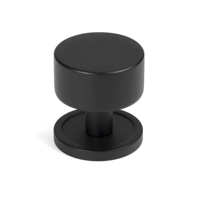 This is an image showing From The Anvil - Matt Black Kelso Cabinet Knob - 32mm (Plain) available from T.H Wiggans Architectural Ironmongery in Kendal, quick delivery and discounted prices