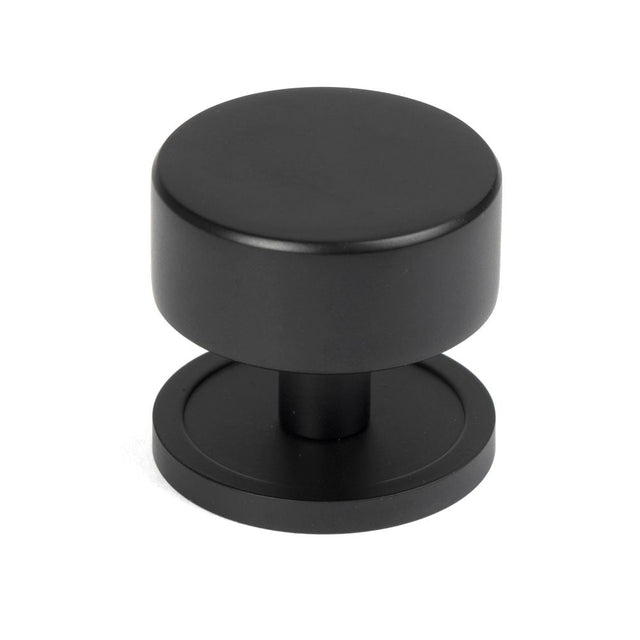 This is an image showing From The Anvil - Matt Black Kelso Cabinet Knob - 38mm (Plain) available from T.H Wiggans Architectural Ironmongery in Kendal, quick delivery and discounted prices