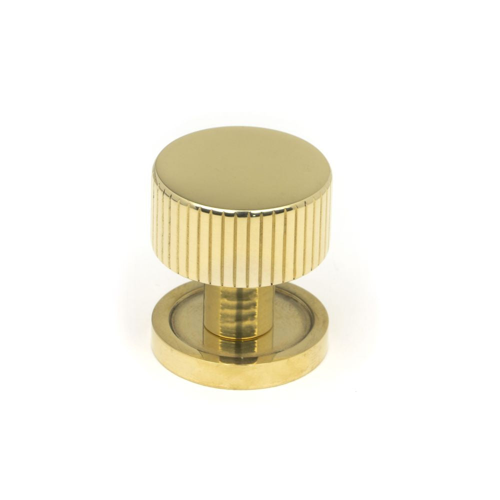 This is an image showing From The Anvil - Polished Brass Judd Cabinet Knob - 25mm (Plain) available from T.H Wiggans Architectural Ironmongery in Kendal, quick delivery and discounted prices
