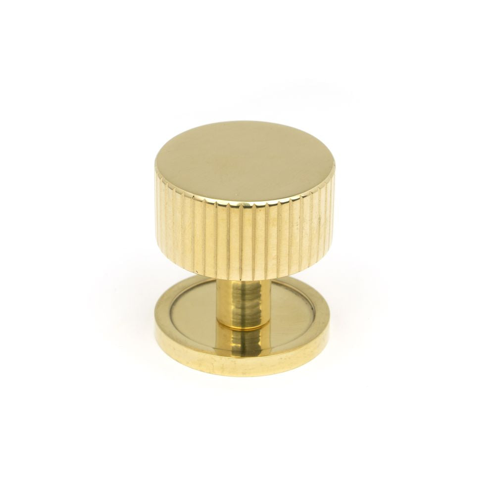 This is an image showing From The Anvil - Polished Brass Judd Cabinet Knob - 32mm (Plain) available from T.H Wiggans Architectural Ironmongery in Kendal, quick delivery and discounted prices