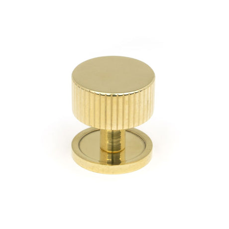 This is an image showing From The Anvil - Polished Brass Judd Cabinet Knob - 32mm (Plain) available from T.H Wiggans Architectural Ironmongery in Kendal, quick delivery and discounted prices