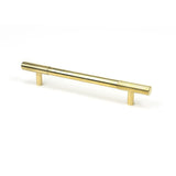 This is an image showing From The Anvil - Polished Brass Judd Pull Handle - Medium available from T.H Wiggans Architectural Ironmongery in Kendal, quick delivery and discounted prices