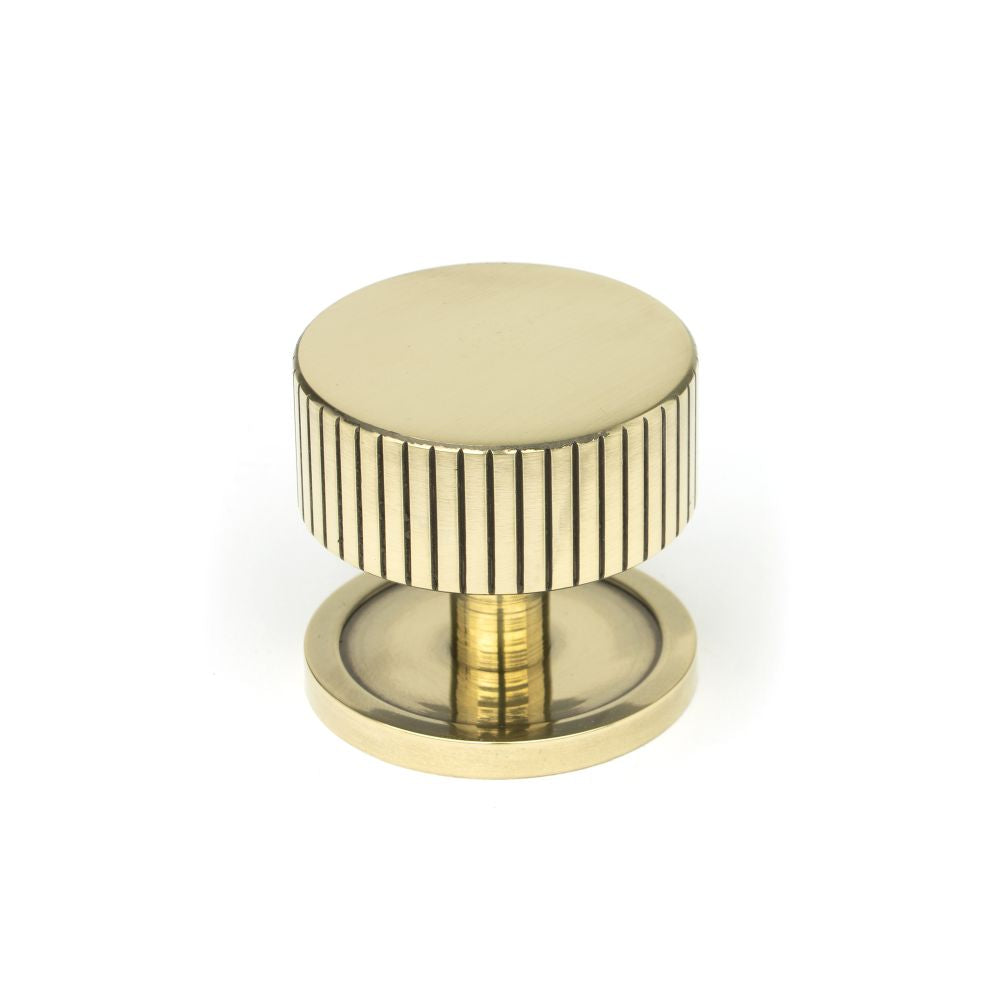 This is an image showing From The Anvil - Aged Brass Judd Cabinet Knob - 38mm (Plain) available from T.H Wiggans Architectural Ironmongery in Kendal, quick delivery and discounted prices