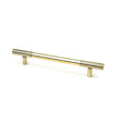 This is an image showing From The Anvil - Aged Brass Judd Pull Handle - Medium available from T.H Wiggans Architectural Ironmongery in Kendal, quick delivery and discounted prices