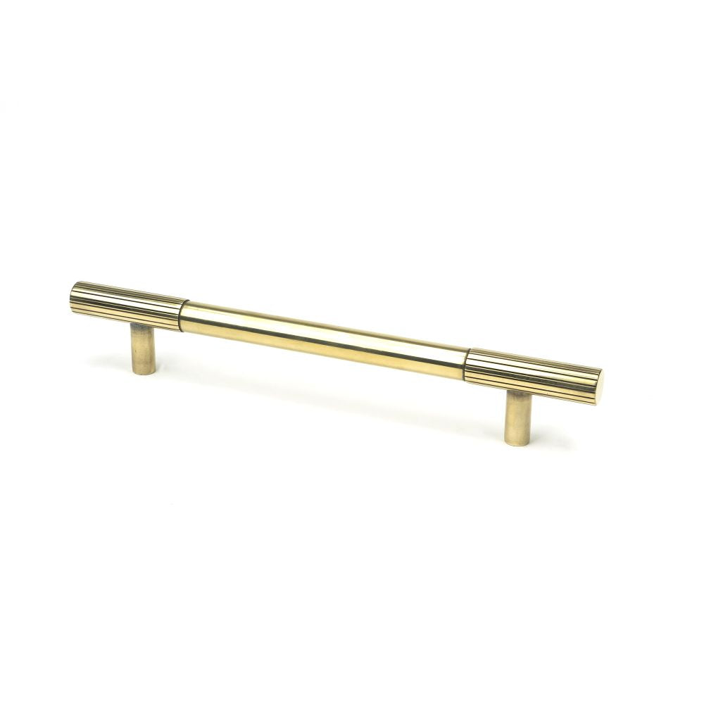 This is an image showing From The Anvil - Aged Brass Judd Pull Handle - Medium available from T.H Wiggans Architectural Ironmongery in Kendal, quick delivery and discounted prices