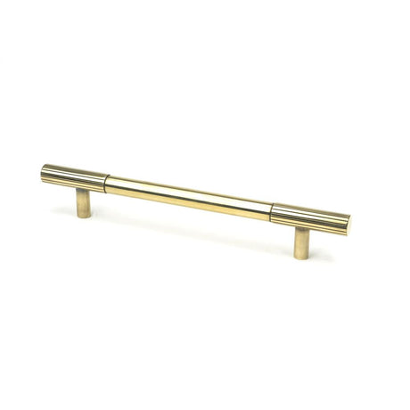 This is an image showing From The Anvil - Aged Brass Judd Pull Handle - Medium available from T.H Wiggans Architectural Ironmongery in Kendal, quick delivery and discounted prices