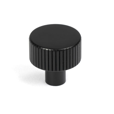 This is an image showing From The Anvil - Matt Black Judd Cabinet Knob - 25mm (No rose) available from T.H Wiggans Architectural Ironmongery in Kendal, quick delivery and discounted prices