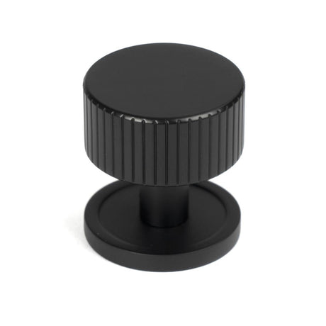 This is an image showing From The Anvil - Matt Black Judd Cabinet Knob - 32mm (Plain) available from T.H Wiggans Architectural Ironmongery in Kendal, quick delivery and discounted prices
