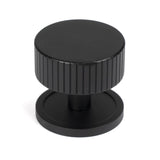 This is an image showing From The Anvil - Matt Black Judd Cabinet Knob - 38mm (Plain) available from T.H Wiggans Architectural Ironmongery in Kendal, quick delivery and discounted prices