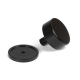 This is an image showing From The Anvil - Aged Bronze Kelso Cabinet Knob - 38mm (Plain) available from trade door handles, quick delivery and discounted prices