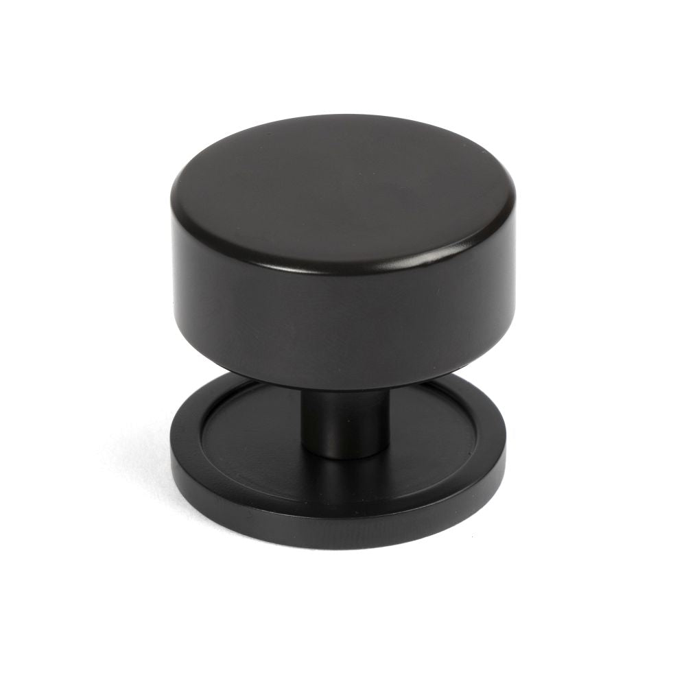 This is an image showing From The Anvil - Aged Bronze Kelso Cabinet Knob - 38mm (Plain) available from T.H Wiggans Architectural Ironmongery in Kendal, quick delivery and discounted prices
