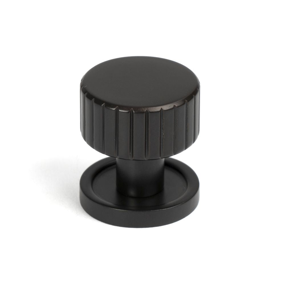 This is an image showing From The Anvil - Aged Bronze Judd Cabinet Knob - 25mm (Plain) available from T.H Wiggans Architectural Ironmongery in Kendal, quick delivery and discounted prices