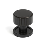 This is an image showing From The Anvil - Aged Bronze Judd Cabinet Knob - 25mm (Plain) available from T.H Wiggans Architectural Ironmongery in Kendal, quick delivery and discounted prices