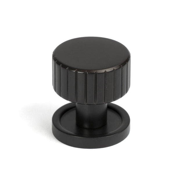 This is an image showing From The Anvil - Aged Bronze Judd Cabinet Knob - 25mm (Plain) available from T.H Wiggans Architectural Ironmongery in Kendal, quick delivery and discounted prices