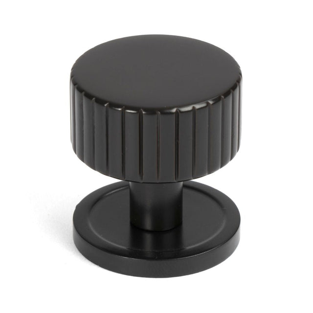 This is an image showing From The Anvil - Aged Bronze Judd Cabinet Knob - 32mm (Plain) available from T.H Wiggans Architectural Ironmongery in Kendal, quick delivery and discounted prices