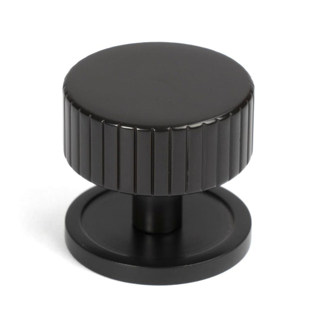 This is an image showing From The Anvil - Aged Bronze Judd Cabinet Knob - 38mm (Plain) available from T.H Wiggans Architectural Ironmongery in Kendal, quick delivery and discounted prices