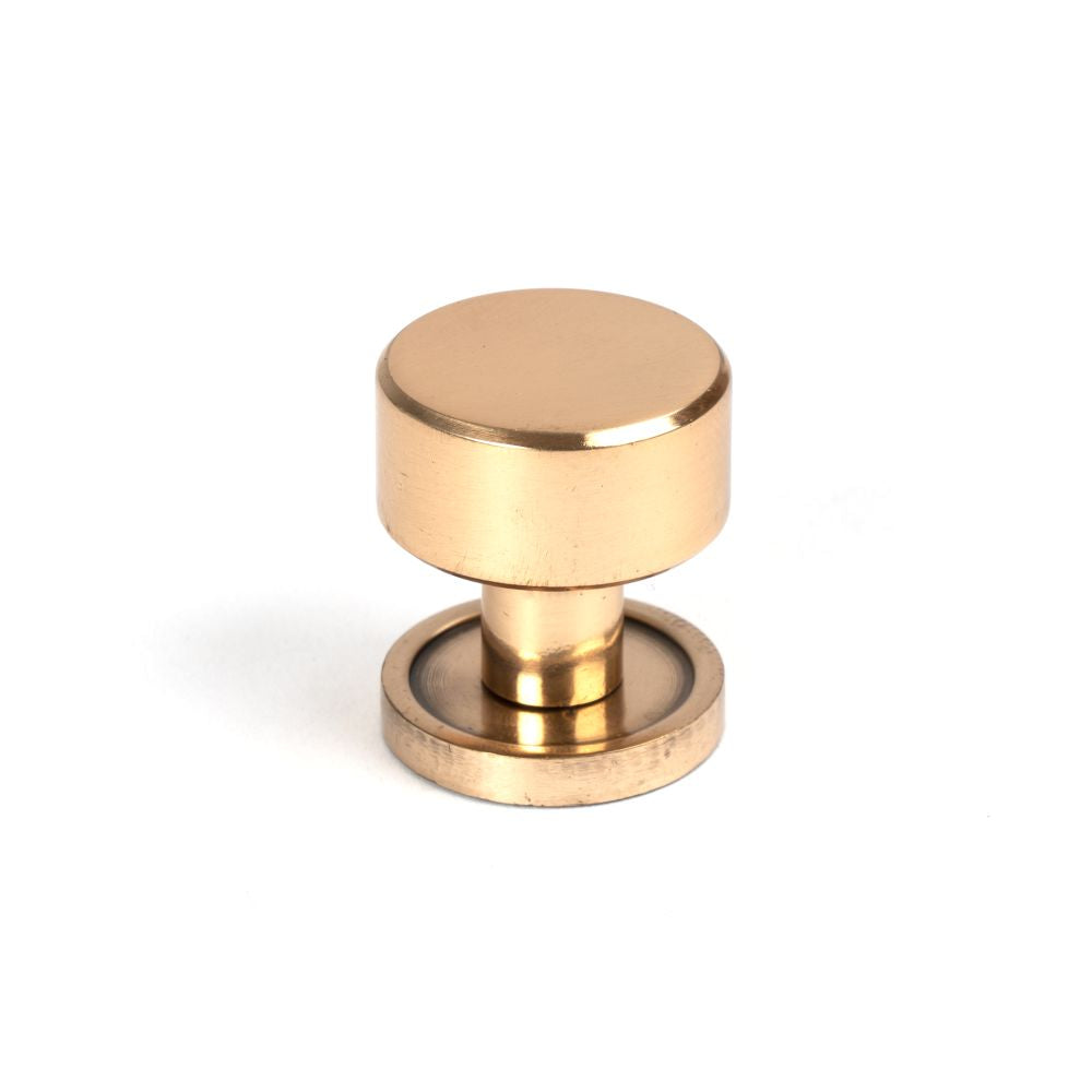 This is an image showing From The Anvil - Polished Bronze Kelso Cabinet Knob - 25mm (Plain) available from T.H Wiggans Architectural Ironmongery in Kendal, quick delivery and discounted prices