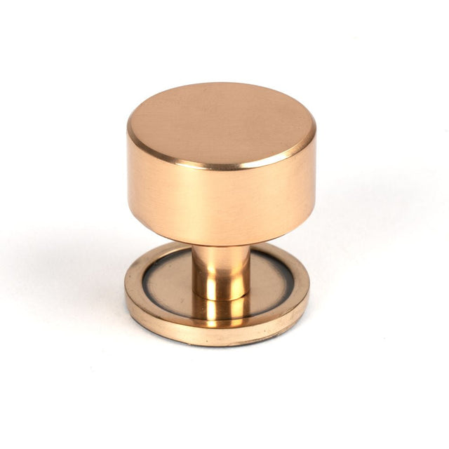 This is an image showing From The Anvil - Polished Bronze Kelso Cabinet Knob - 32mm (Plain) available from T.H Wiggans Architectural Ironmongery in Kendal, quick delivery and discounted prices