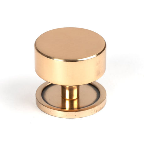This is an image showing From The Anvil - Polished Bronze Kelso Cabinet Knob - 38mm (Plain) available from T.H Wiggans Architectural Ironmongery in Kendal, quick delivery and discounted prices