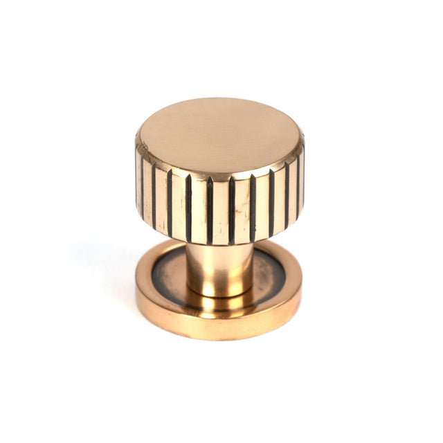 This is an image showing From The Anvil - Polished Bronze Judd Cabinet Knob - 25mm (Plain) available from T.H Wiggans Architectural Ironmongery in Kendal, quick delivery and discounted prices