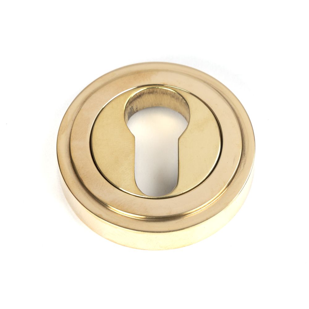 This is an image of From The Anvil - Polished Brass Round Euro Escutcheon (Art Deco) available to order from T.H Wiggans Architectural Ironmongery in Kendal, quick delivery and discounted prices.