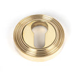 This is an image of From The Anvil - Polished Brass Round Euro Escutcheon (Beehive) available to order from T.H Wiggans Architectural Ironmongery in Kendal, quick delivery and discounted prices.