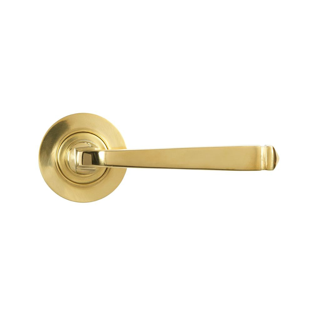 This is an image showing From The Anvil - Polished Brass Avon Round Lever on Rose Set (Plain) - Unsprung available from trade door handles, quick delivery and discounted prices