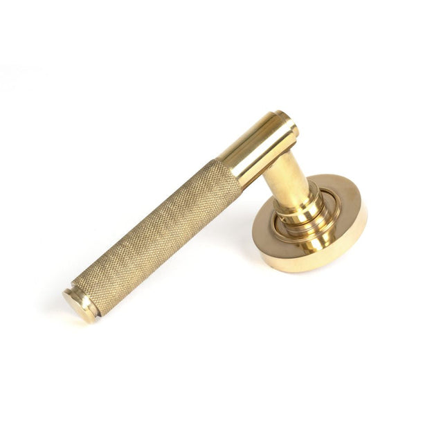 This is an image of From The Anvil - Polished Brass Brompton Lever on Rose Set (Plain) available to order from T.H Wiggans Architectural Ironmongery in Kendal, quick delivery and discounted prices.