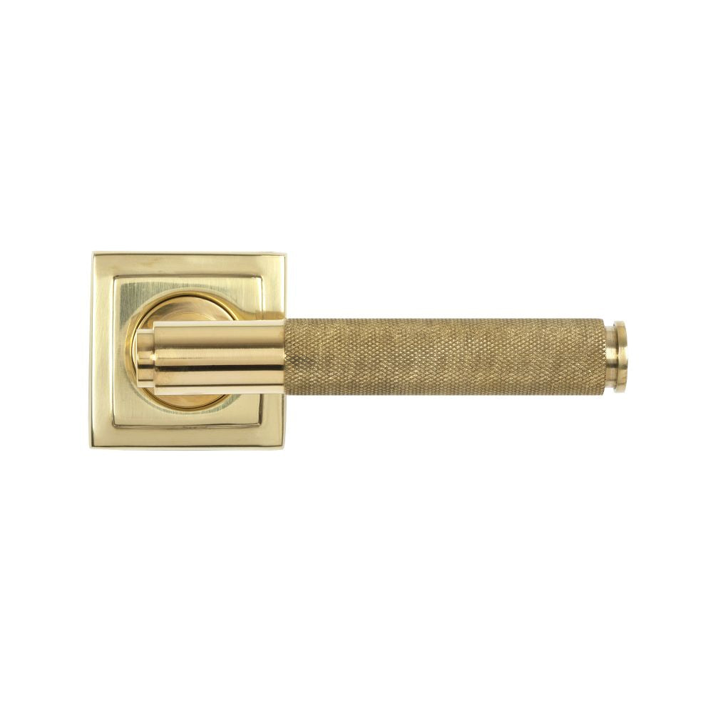 This is an image showing From The Anvil - Polished Brass Brompton Lever on Rose Set (Square) - Unsprung available from trade door handles, quick delivery and discounted prices