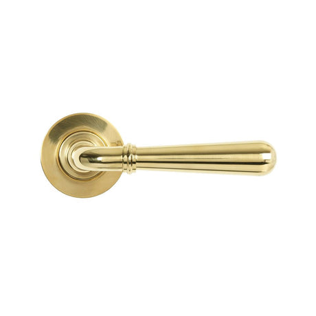 This is an image showing From The Anvil - Polished Brass Newbury Lever on Rose Set (Plain) available from trade door handles, quick delivery and discounted prices