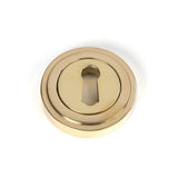 This is an image of From The Anvil - Polished Brass Round Escutcheon (Art Deco) available to order from T.H Wiggans Architectural Ironmongery in Kendal, quick delivery and discounted prices.